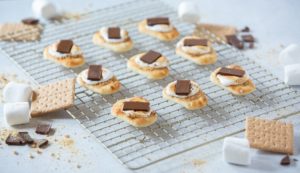Gooey s'mores assembled on Stonefire® Naan Dippers® with melted chocolate and marshmallow, ready for a sweet treat."